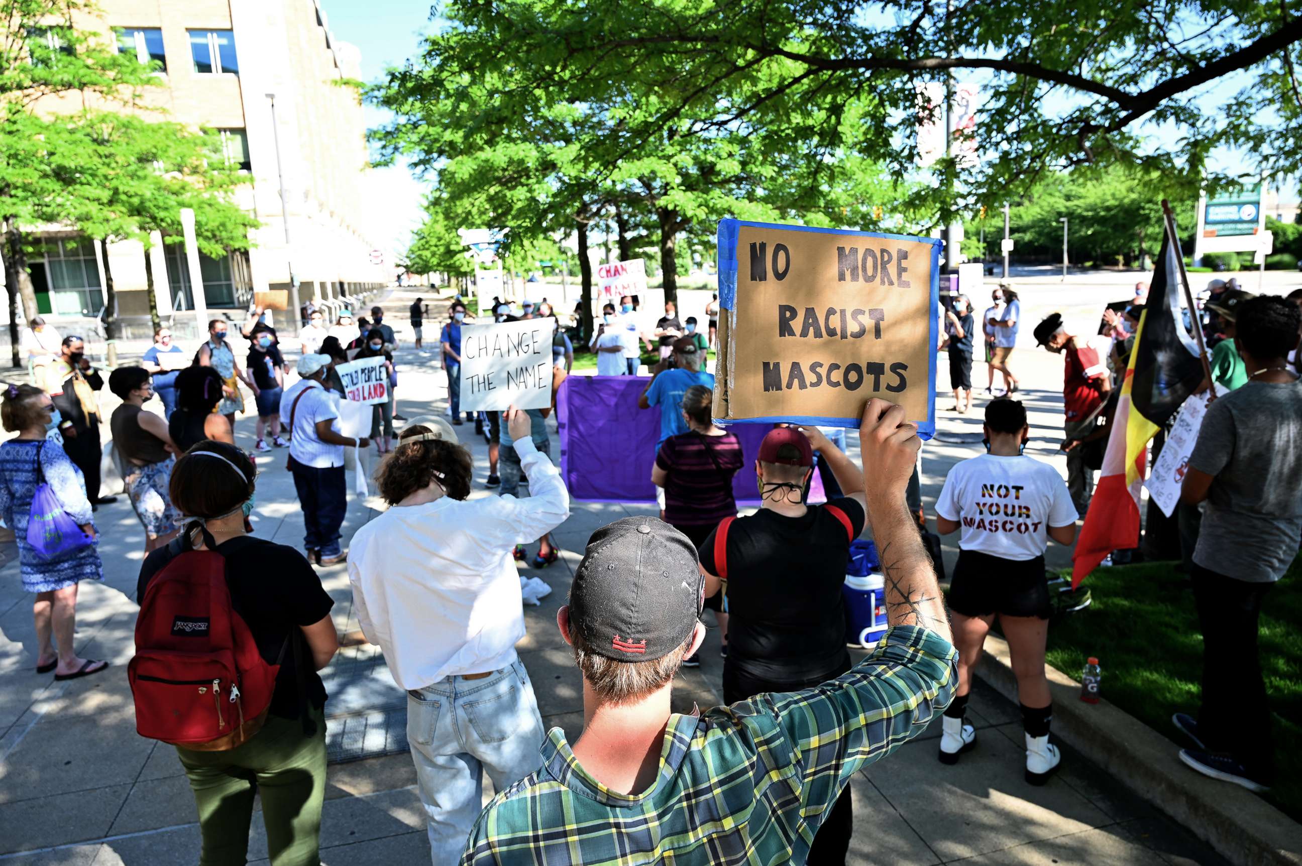 PHOTO: A protestor speaks to a crowd of demonstrators prior to the Opening Day game between the Cleveland Indians and the Kansas City Royals at Progressive Field, July 24, 2020, in Cleveland.