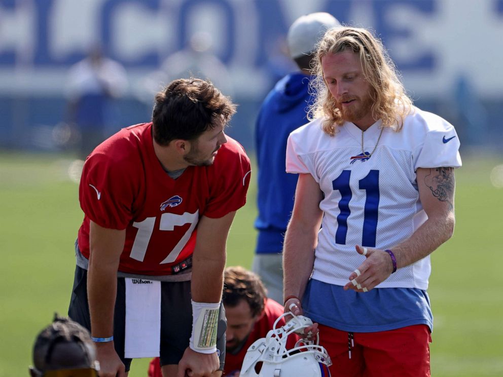 PHOTO: Josh Allen #17 of the Buffalo Bills and Cole Beasley #11 of the Buffalo Bills talk during training camp at the Adpro Sports Training Center on July 28, 2021 in Orchard Park, New York.