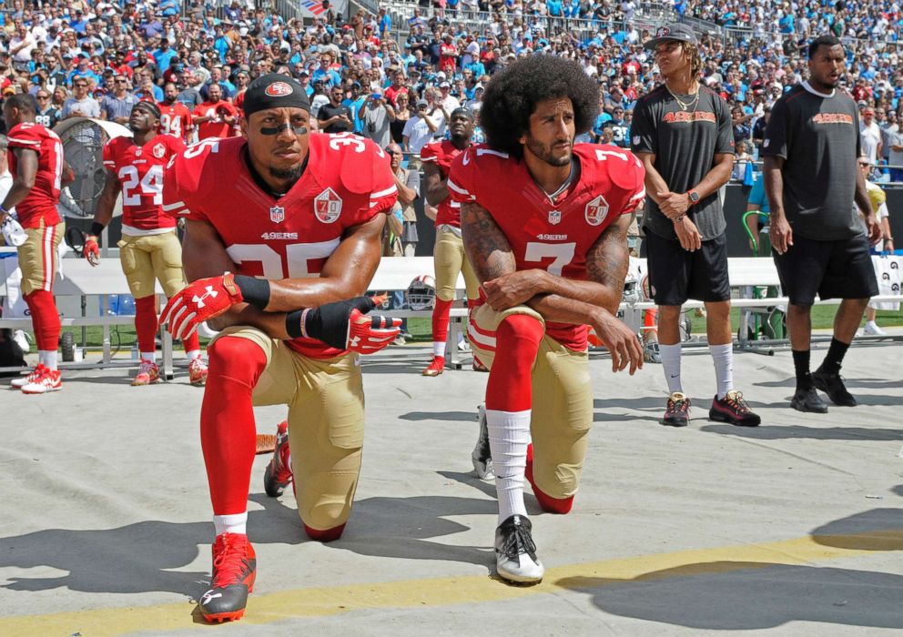 PHOTO: San Francisco 49ers Colin Kaepernick (7) and Eric Reid (35) kneel during the national anthem before an NFL football game against the Carolina Panthers, in Charlotte, N.C., Sept. 18, 2016.