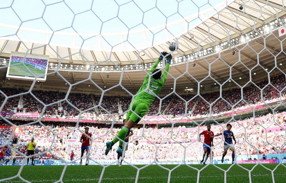 PHOTO: Costa Rica's Keysher Fuller scores their first goal against Japan's Shuichi Gonda, on Nov. 27, 2022.