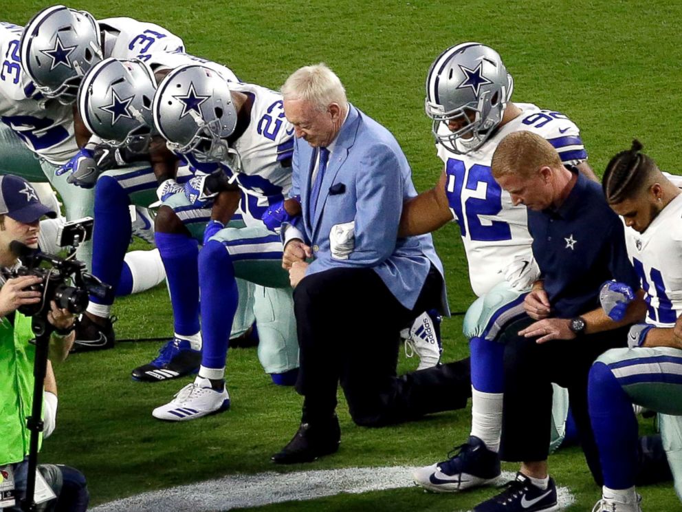 PHOTO: The Dallas Cowboys, led by owner Jerry Jones, center, take a knee prior to the national anthem prior to an NFL football game against the Arizona Cardinals, Sept. 25, 2017, in Glendale, Ariz.