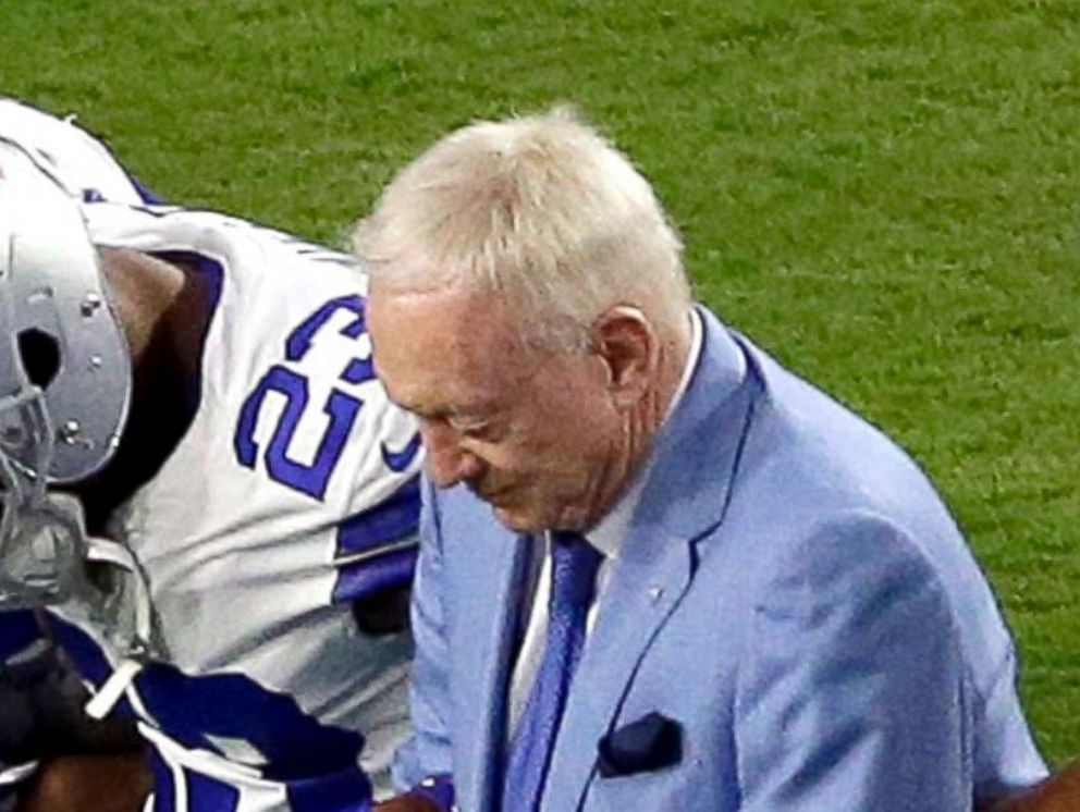 PHOTO: The Dallas Cowboys, led by owner Jerry Jones, center, take a knee prior to the national anthem prior to an NFL football game against the Arizona Cardinals, Sept. 25, 2017, in Glendale, Ariz.