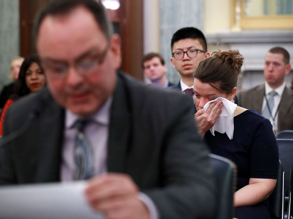 PHOTO: A woman weeps while listening to figure skater Craig Maurizi recount his sexual abuse at the hands of his coach when he was 13 years old while testifying before a Senate subcommittee on Capitol Hill April 18, 2018 in Washington.