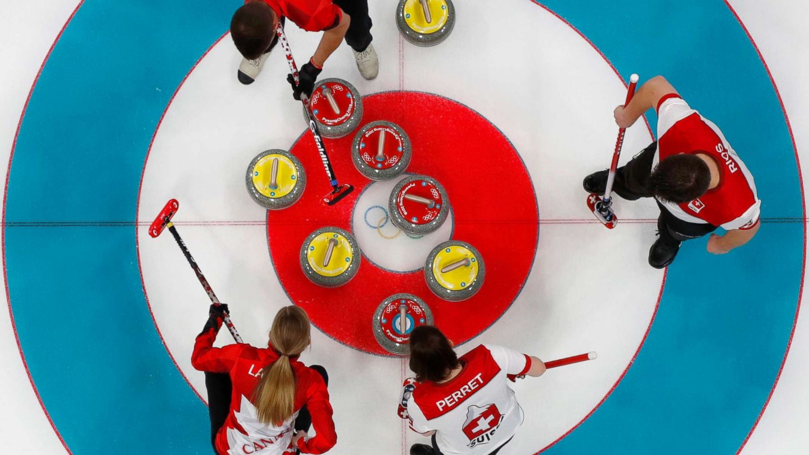 PHOTO: Kaitlyn Lawes of Canada, John Morris of Canada, Jenny Perret of Switzerland and Martin Rios of Switzerland play in the Curling Mixed Doubles Final of the Pyeongchang 2018 Winter Olympics, Feb. 13, 2018.