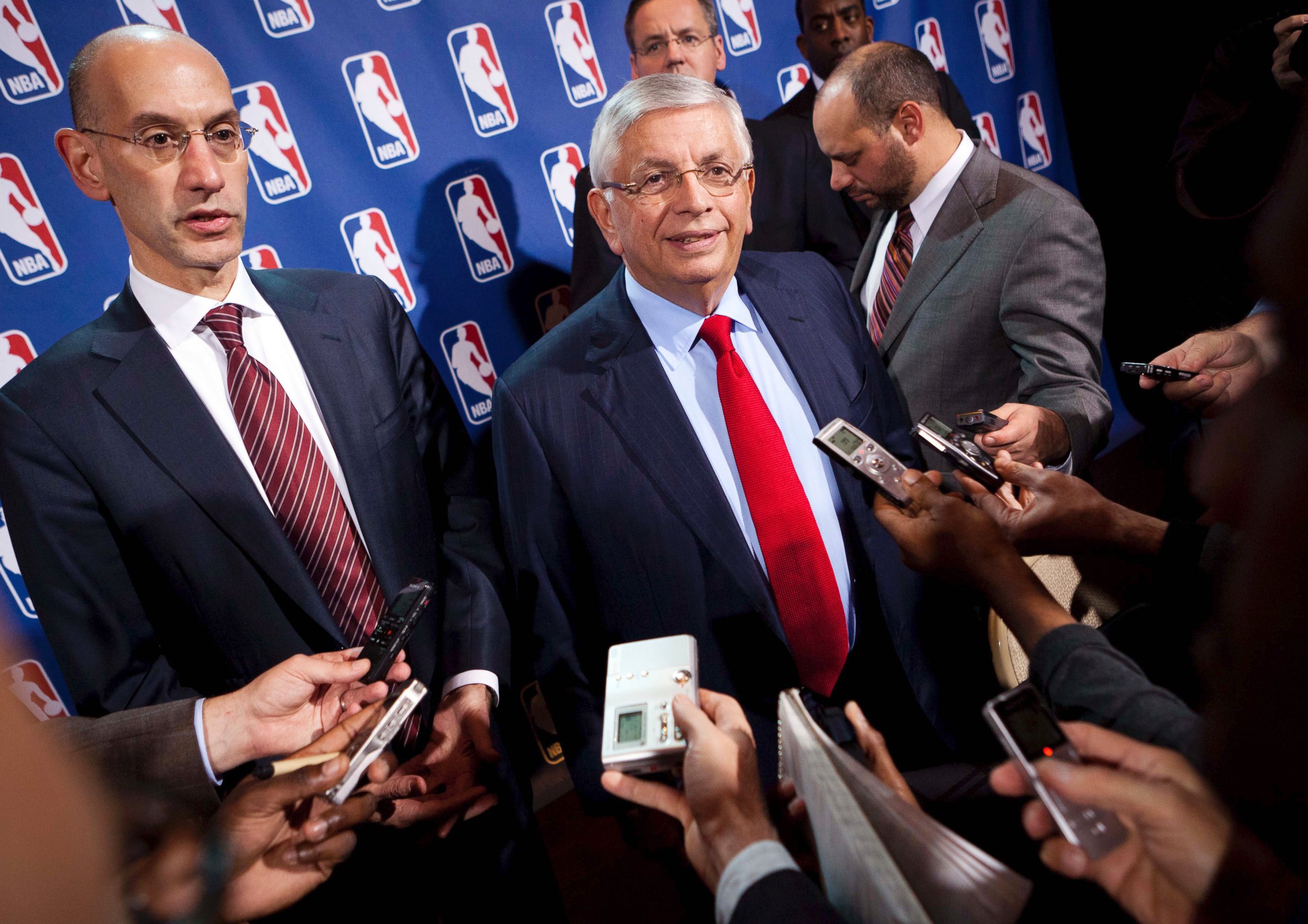 PHOTO: In this Nov. 10, 2011, file photo, NBA Commissioner David Stern, center, speaks to the news media alongside Deputy commissioner Adam Silver after a marathon meeting with the Players Association in New York.