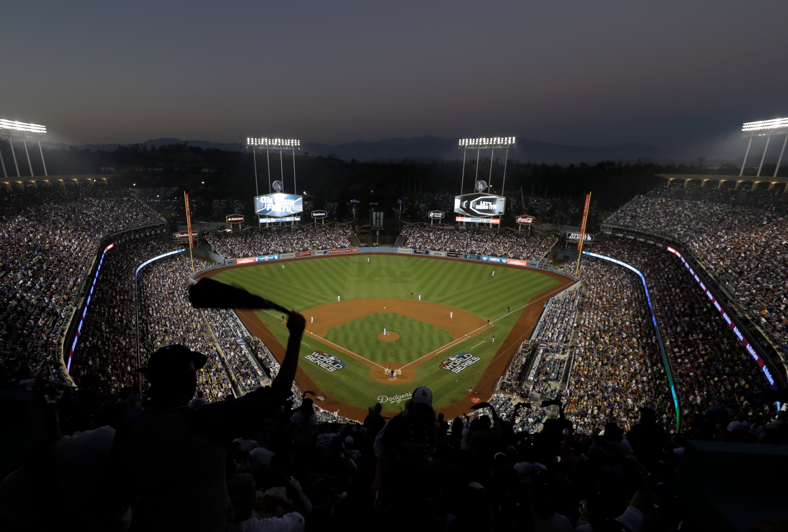 PHOTO: Fans cheer from the top of Dodger Stadium during Game 4 of the World Series baseball game between the Boston Red Sox and Los Angeles Dodgers on Saturday, Oct. 27, 2018, in Los Angeles. 