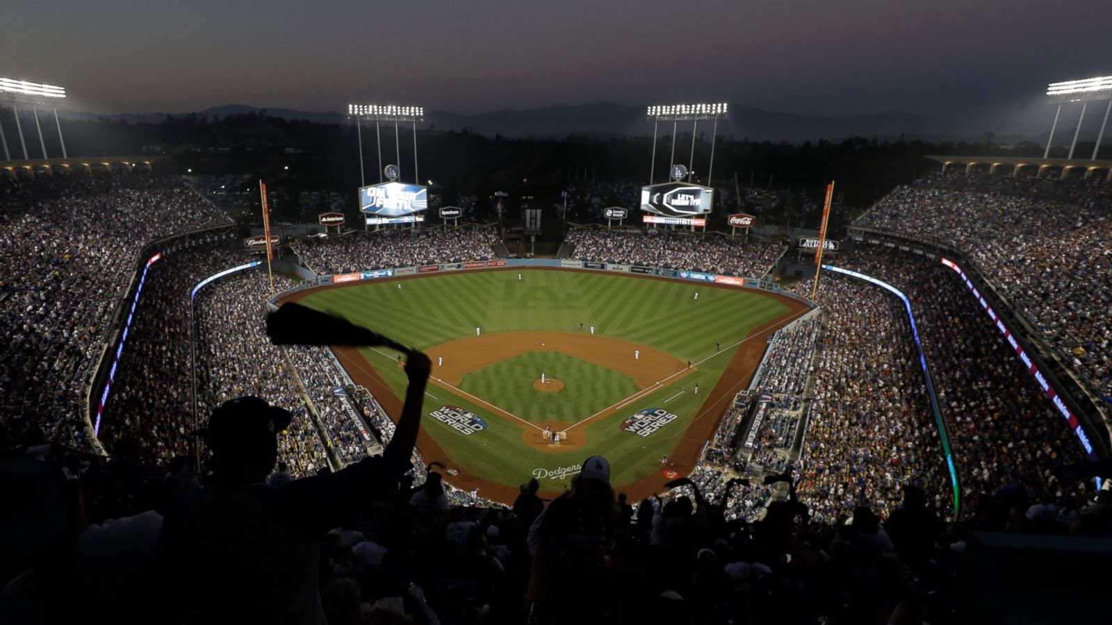 Dodgers fans fight back tears • The Associated Press