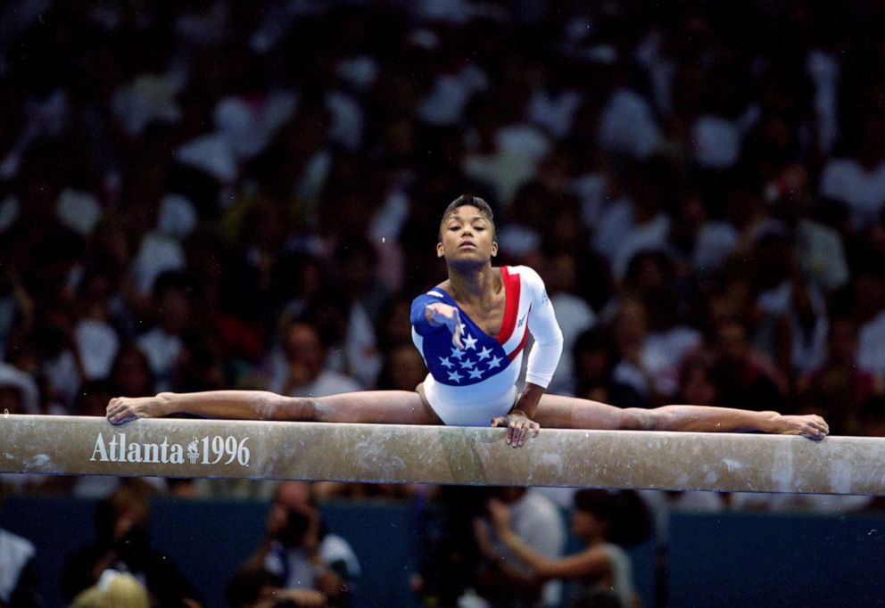 PHOTO: Dominique Dawes of the USA competes on the balance beam at the Georgia Dome during the 1996 Olympic Games in Atlanta, Georgia, July 23, 1996.