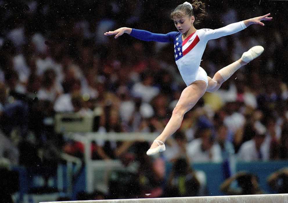 PHOTO: Dominique Moceanu of the USA competes during the women's balance beam event at the Georgia Dome in the 1996 Olympic Games in Atlanta, Georgia, July 23, 1996.