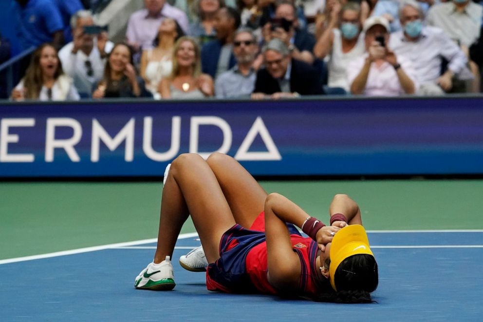PHOTO: Emma Raducanu, of Britain, lies on the court after defeating Leylah Fernandez, of Canada, during the women's singles final of the US Open tennis championships, Saturday, Sept. 11, 2021, in New York.
