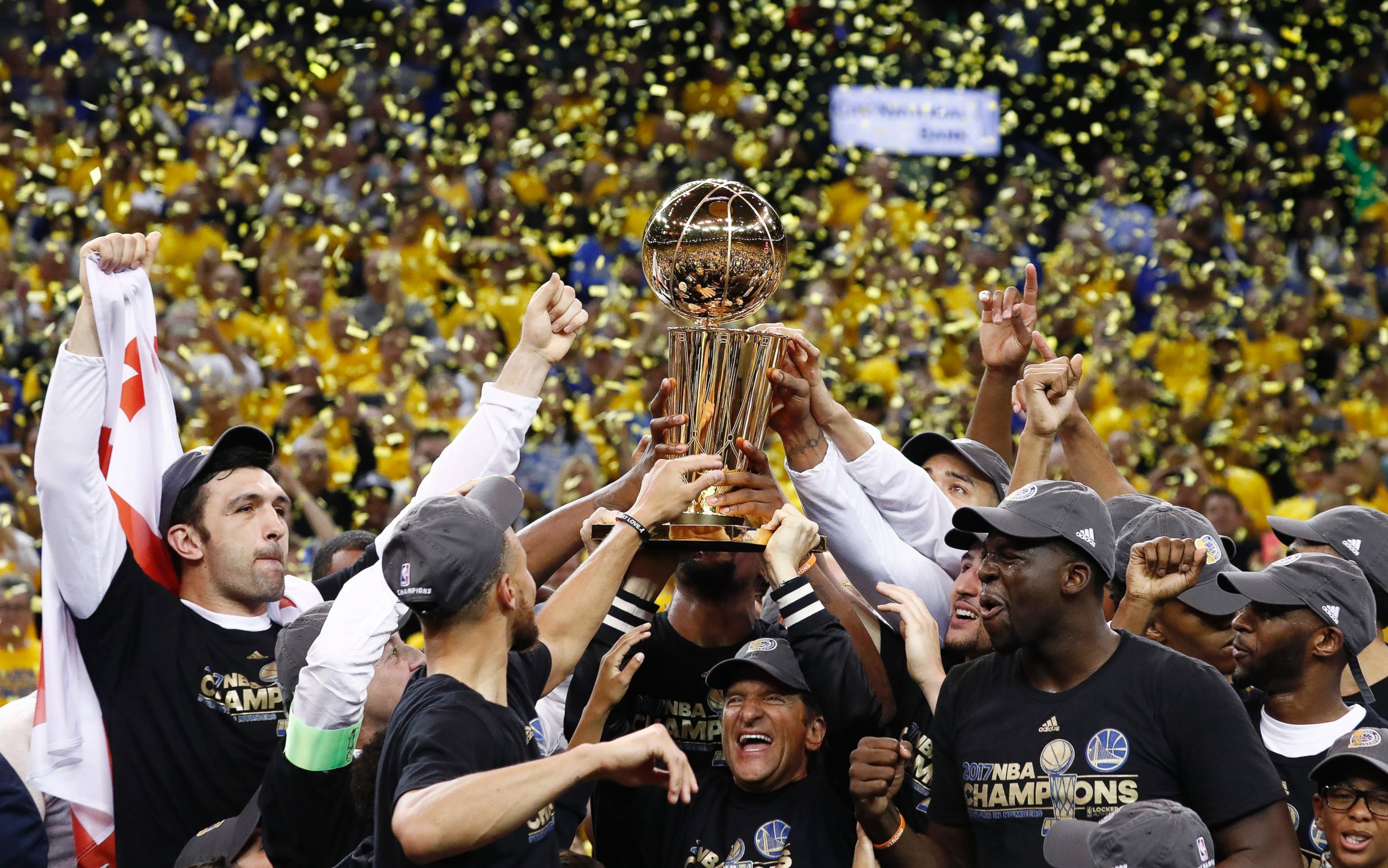 PHOTO: The Golden State Warriors celebrate with the Larry O'Brien NBA Championship Trophy after winning the NBA Finals against the Cleveland Cavaliers in game five of the NBA Finals basketball game at Oracle Arena in Oakland, Calif., June 12, 2017.  