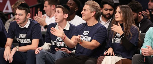 Fans wearing 'Fight Antisemitism' shirts sit courtside at Nets game - News