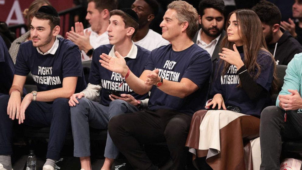PHOTO: Fans wearing shirts with the phrase "Fight Antisemitism" react during the first half of the game between the Brooklyn Nets and the Indiana Pacers at Barclays Center in New York City on Oct. 31, 2022.