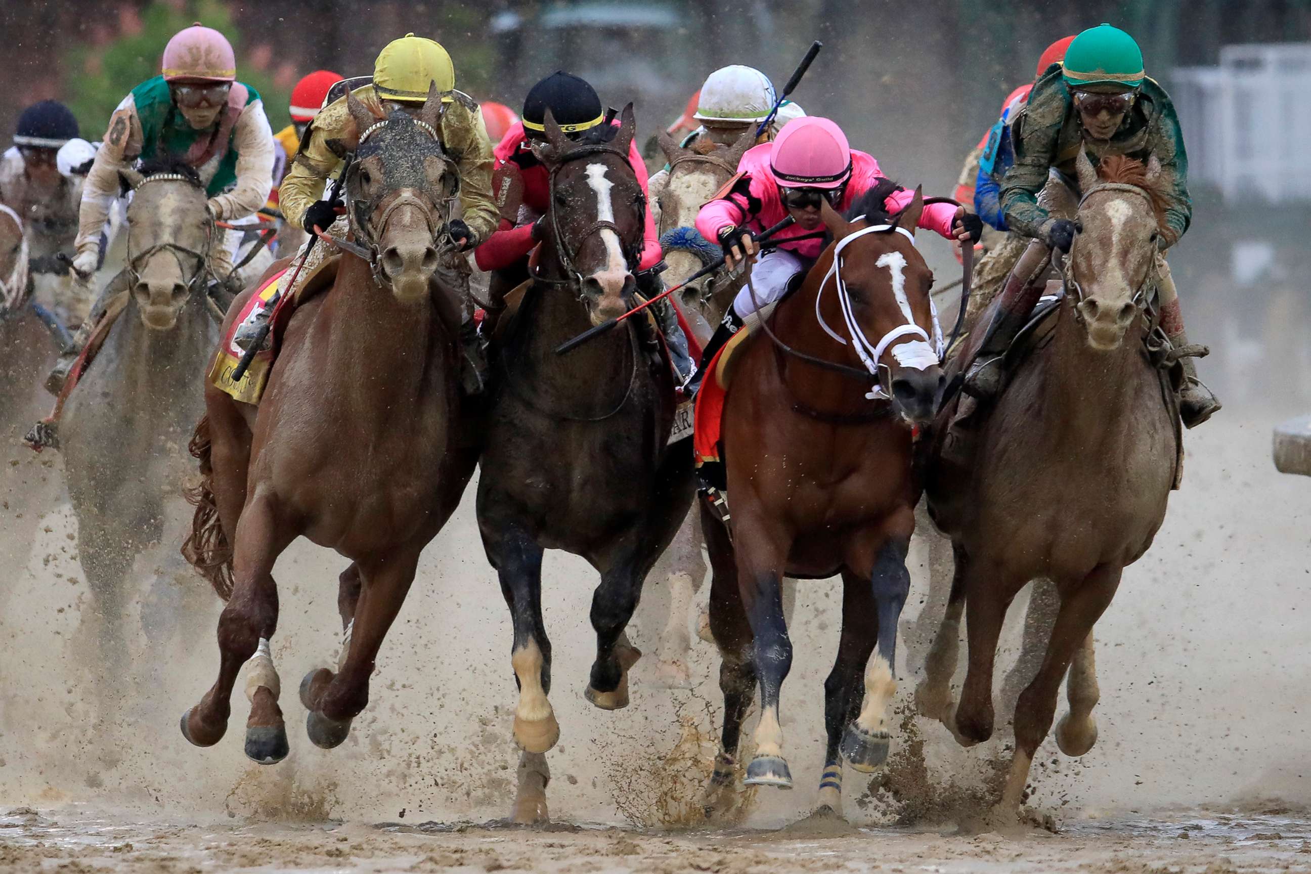 PHOTO: From left, Country House, War of Will, Maximum Security and Code of Honor fight for position in the final turn during the Kentucky Derby, May 4, 2019 in Louisville, Ky. 