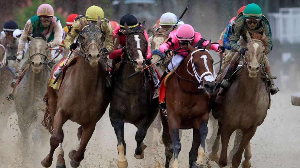 PHOTO: From left, Country House, War of Will, Maximum Security and Code of Honor fight for position in the final turn during the Kentucky Derby, May 4, 2019 in Louisville, Ky. 