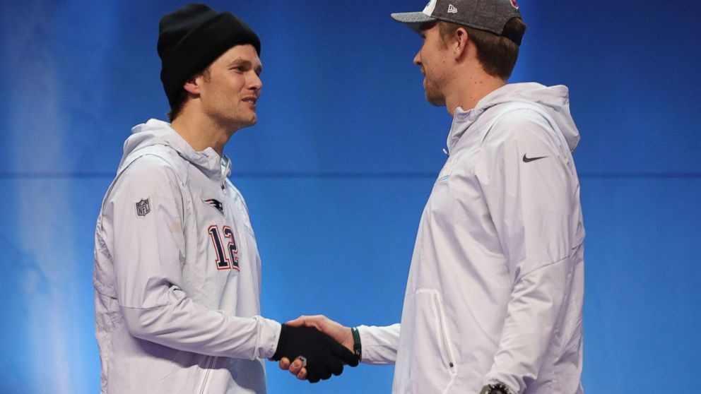 PHOTO: Tom Brady #12 of the New England Patriots and Nick Foles #9 of the Philadelphia Eagles shake hands during Super Bowl Media Day at Xcel Energy Center, Jan. 29, 2018, in St Paul, Minn.   