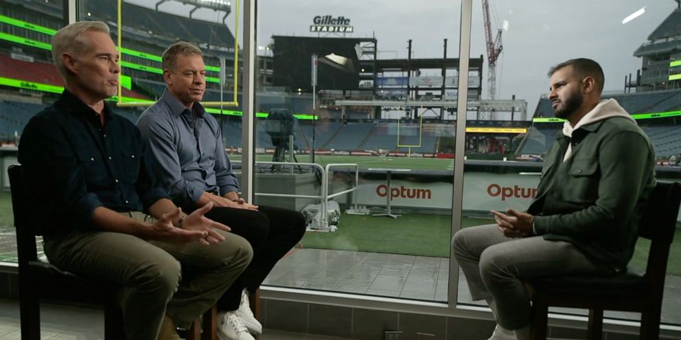 PHOTO: "Monday Night Football" commentators Joe Buck and Troy Aikman talk with ABC News' Ashan Singh.