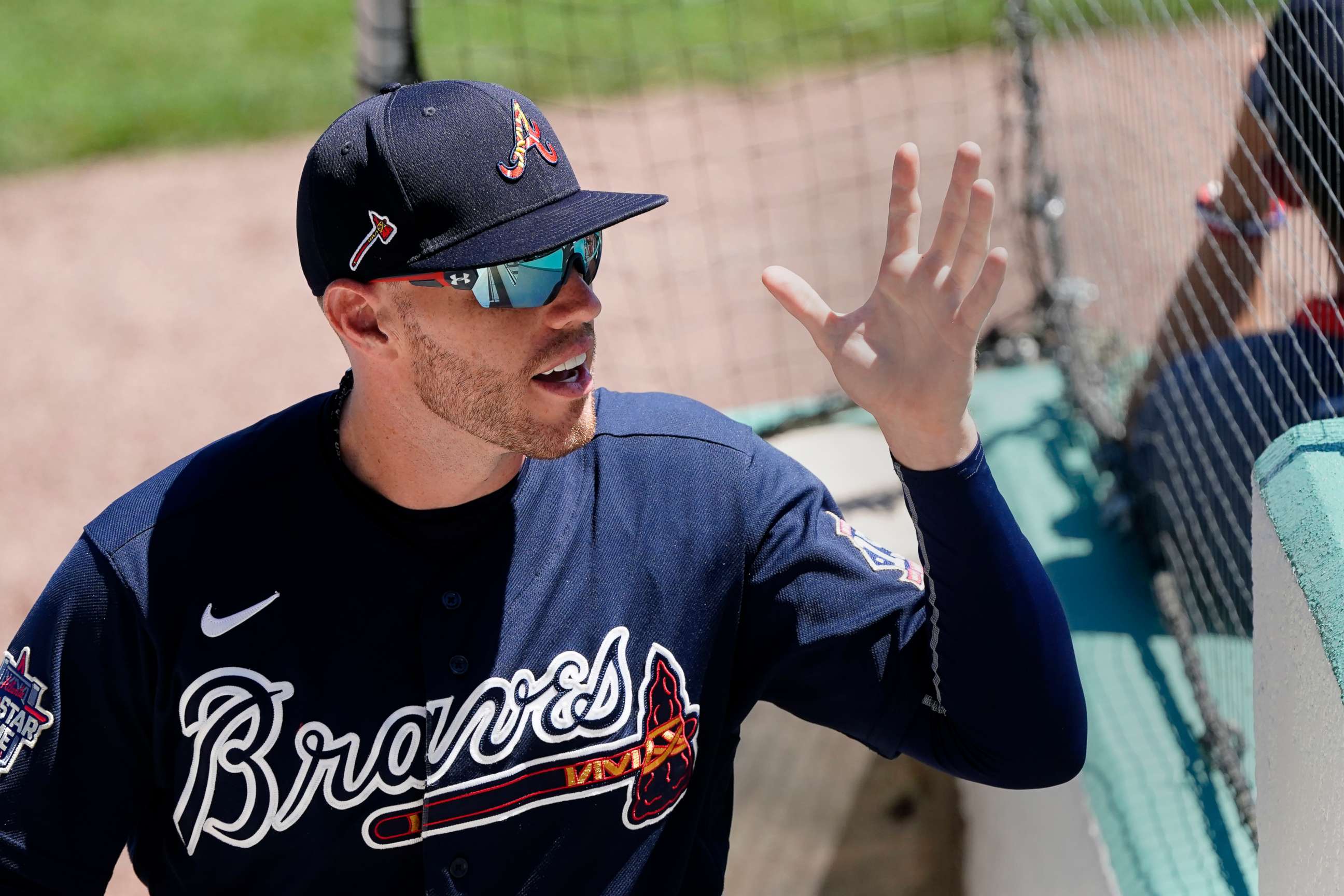 PHOTO: Atlanta Braves first baseman Freddie Freeman waves to fans as he exits a spring training baseball game against the Boston Red Sox in Fort Myers, Fla., in this Tuesday, March 30, 2021, file photo.