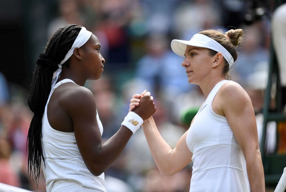 PHOTO: Cori Gauff of the U.S. congratulates Romania's Simona Halep, right, after their fourth round match at Wimbledon, July 8, 2019, in London.