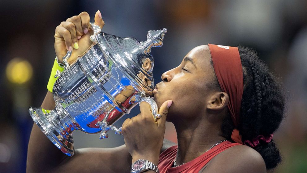 PHOTO: Coco Gauff of the United States with the winner's trophy after her victory against Aryna Sabalenka of Belarus in the Women's Singles Final on Arthur Ashe Stadium during the US Open Tennis Championship 2023.