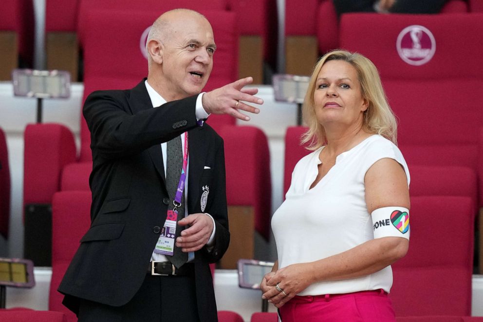 PHOTO: German Football Federation President Bernd Neuendorf talks to German Interior Minister Nancy Faeser wearing the One Love armband on the tribune prior to the World Cup group E soccer match between Germany and Japan, in Qatar, Nov. 23, 2022.