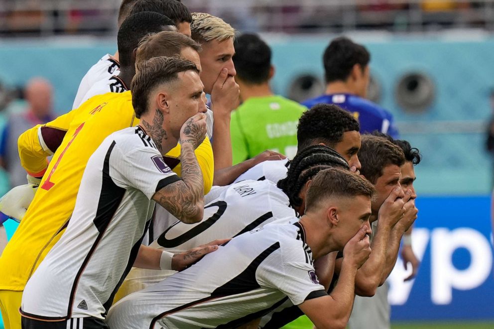 PHOTO: Germany players put their hands on their mouths as they pose for a group photo prior to the World Cup group E soccer match between Germany and Japan, at the Khalifa International Stadium in Doha, Qatar, Wednesday, Nov. 23, 2022.