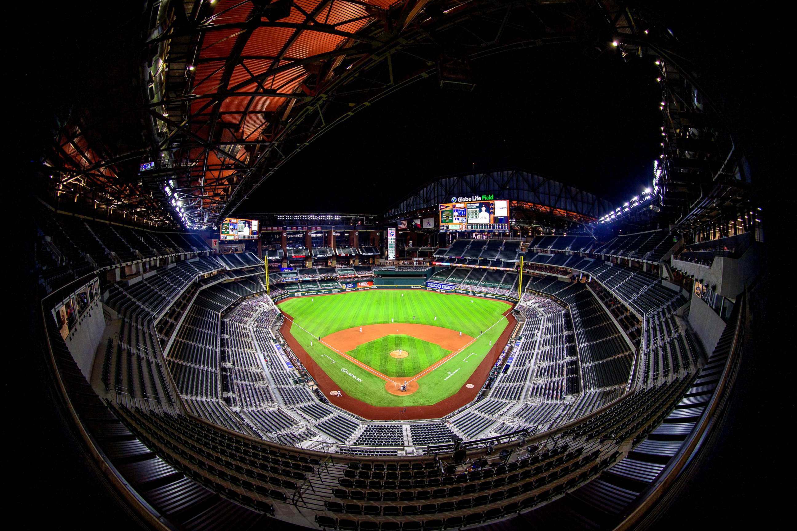 PHOTO: A view of the stands and the open roof during the game between the Texas Rangers and the Houston Astros at Globe Life Field.