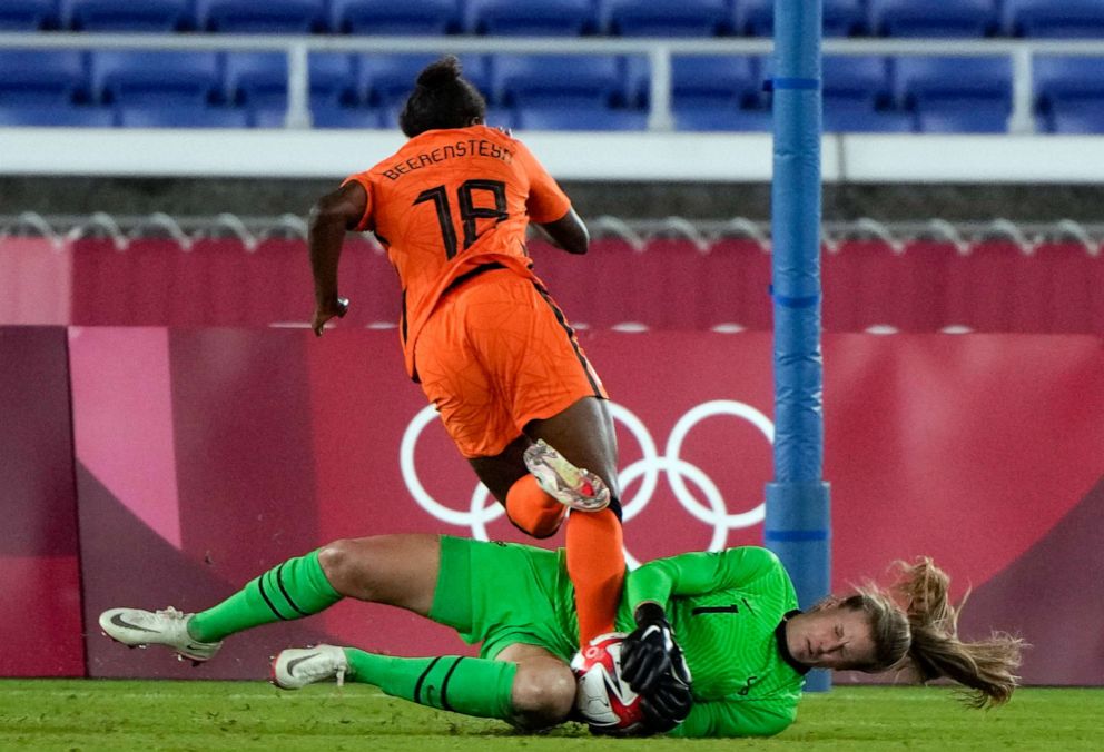 PHOTO: United States' goalkeeper Alyssa Naeher catches the ball as Netherlands' Lineth Beerensteyn challenges her during a women's quarterfinal soccer match at the Tokyo Olympics, July 30, 2021, in Yokohama, Japan.