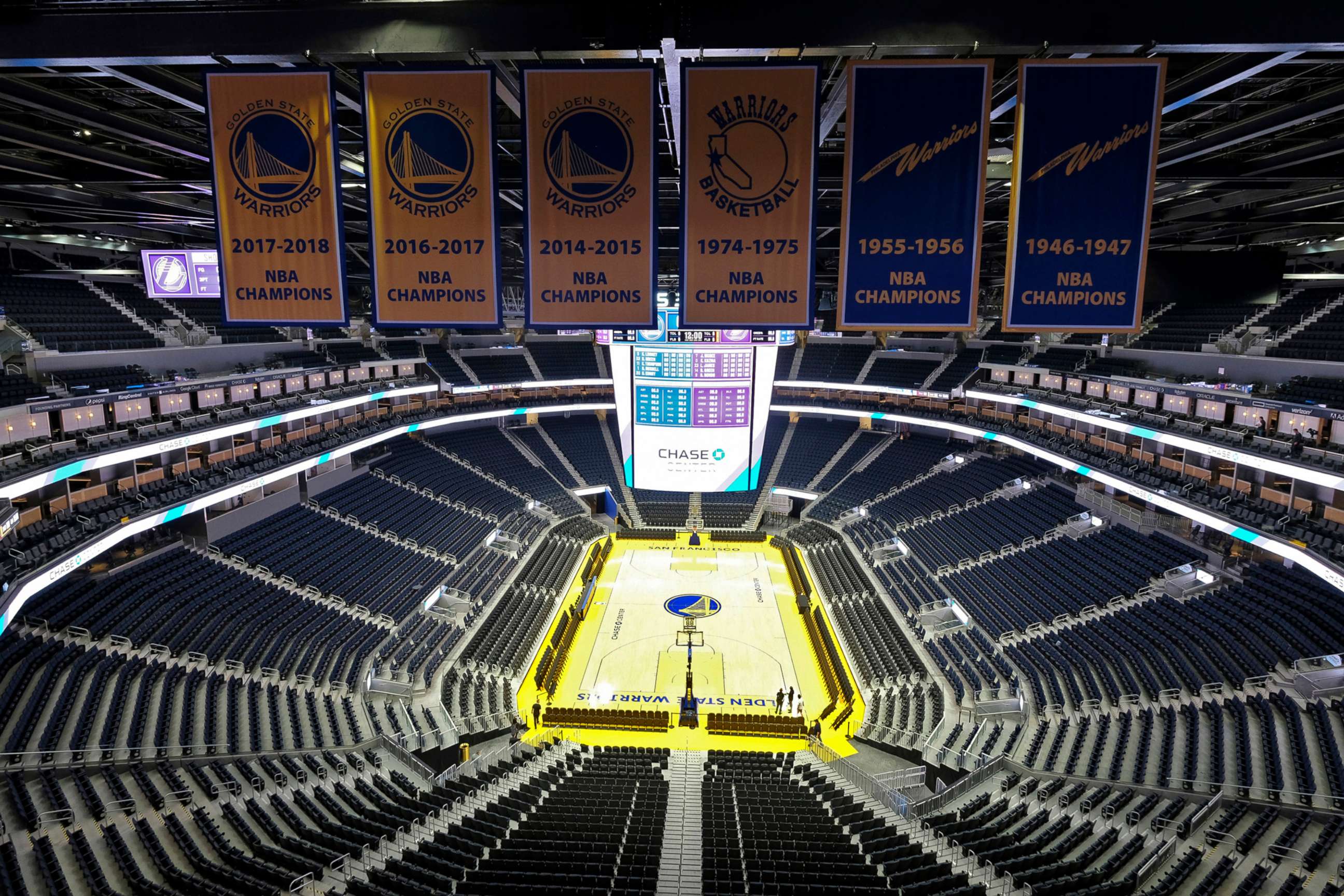 PHOTO: The Golden State Warriors championship banners hang above the seating and basketball court at the Chase Center in San Francisco, Aug. 26, 2019.