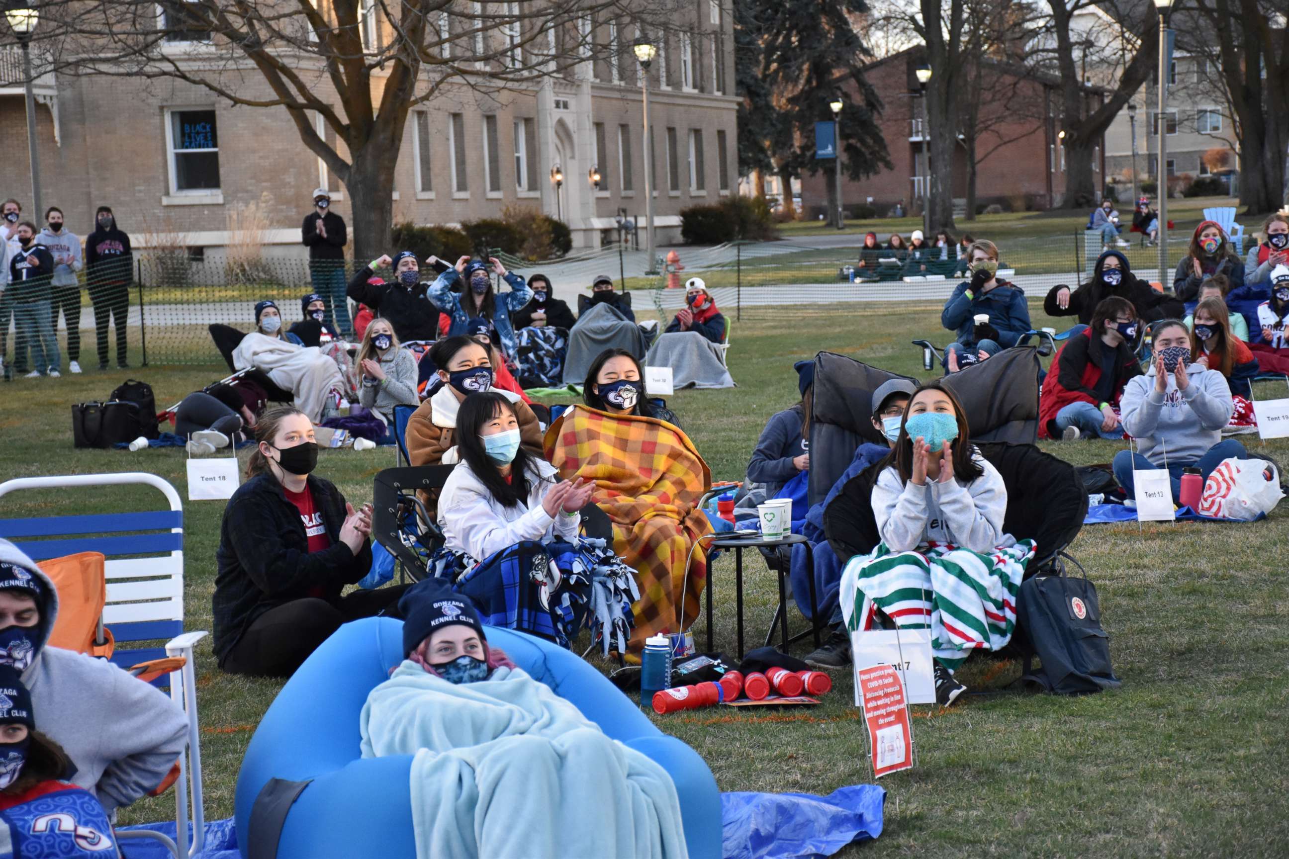 PHOTO: Students gather in pods on Gonzaga University's campus for a March Madness watch party.