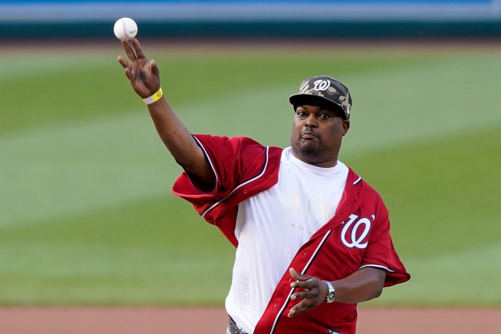 PHOTO: U.S. Capitol Police officer Eugene Goodman throws out the first pitch before the Washington Nationals baseball game against the New York Mets, Friday, June 18, 2021, in Washington.