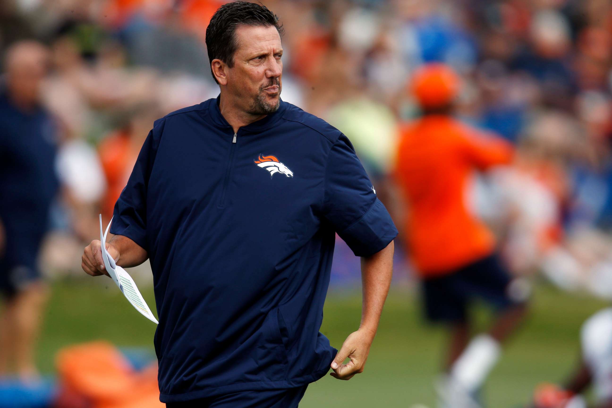 PHOTO: In this Aug. 4, 2016, file photo, Denver Broncos quarterbacks coach Greg Knapp watches during NFL football training camp in Englewood, Colo. 