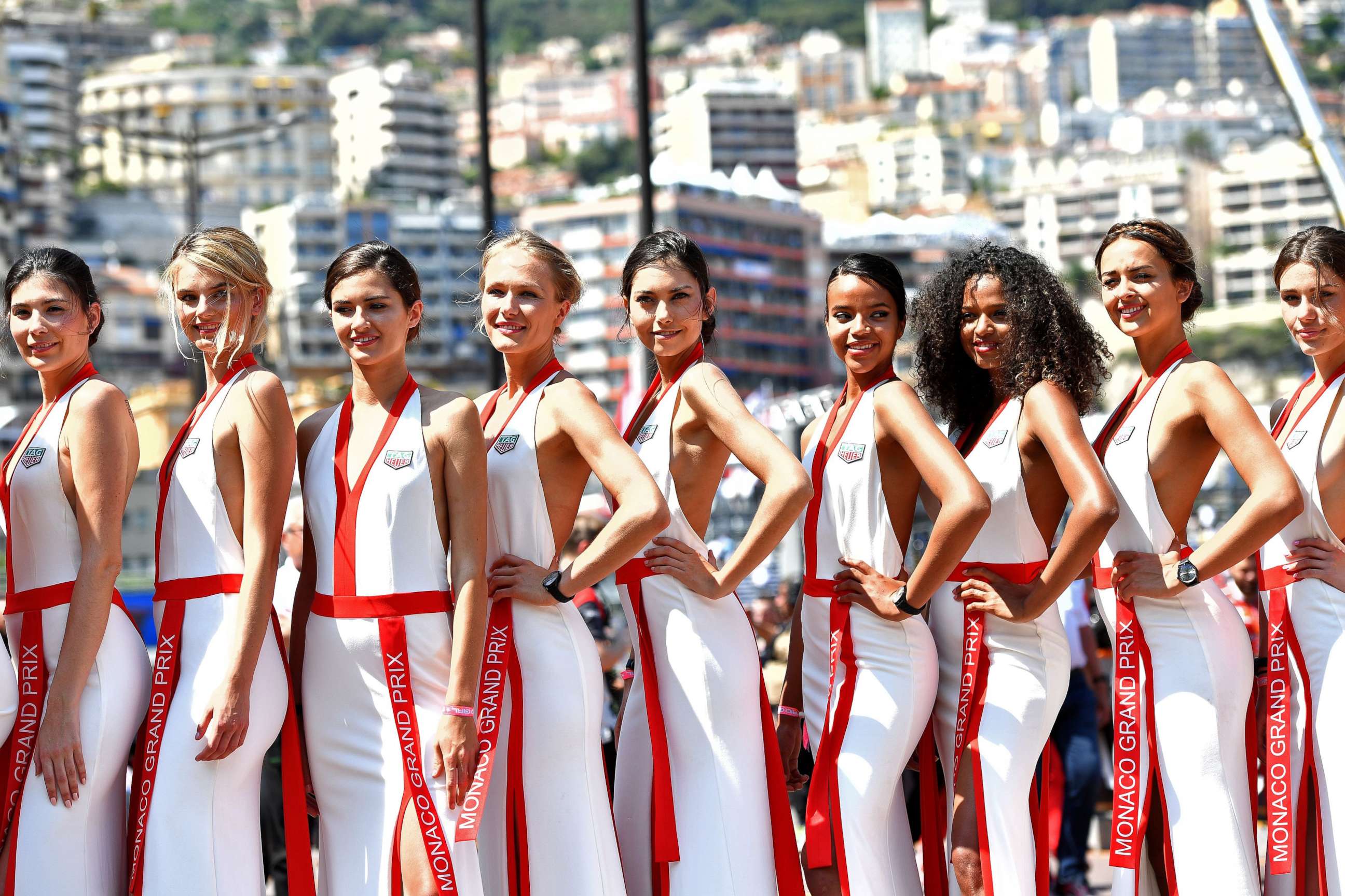 PHOTO: Grid girls pose for photographers after the qualifying session at the Monaco street circuit, May 27, 2017, in Monaco, ahead of the Monaco Formula 1 Grand Prix.