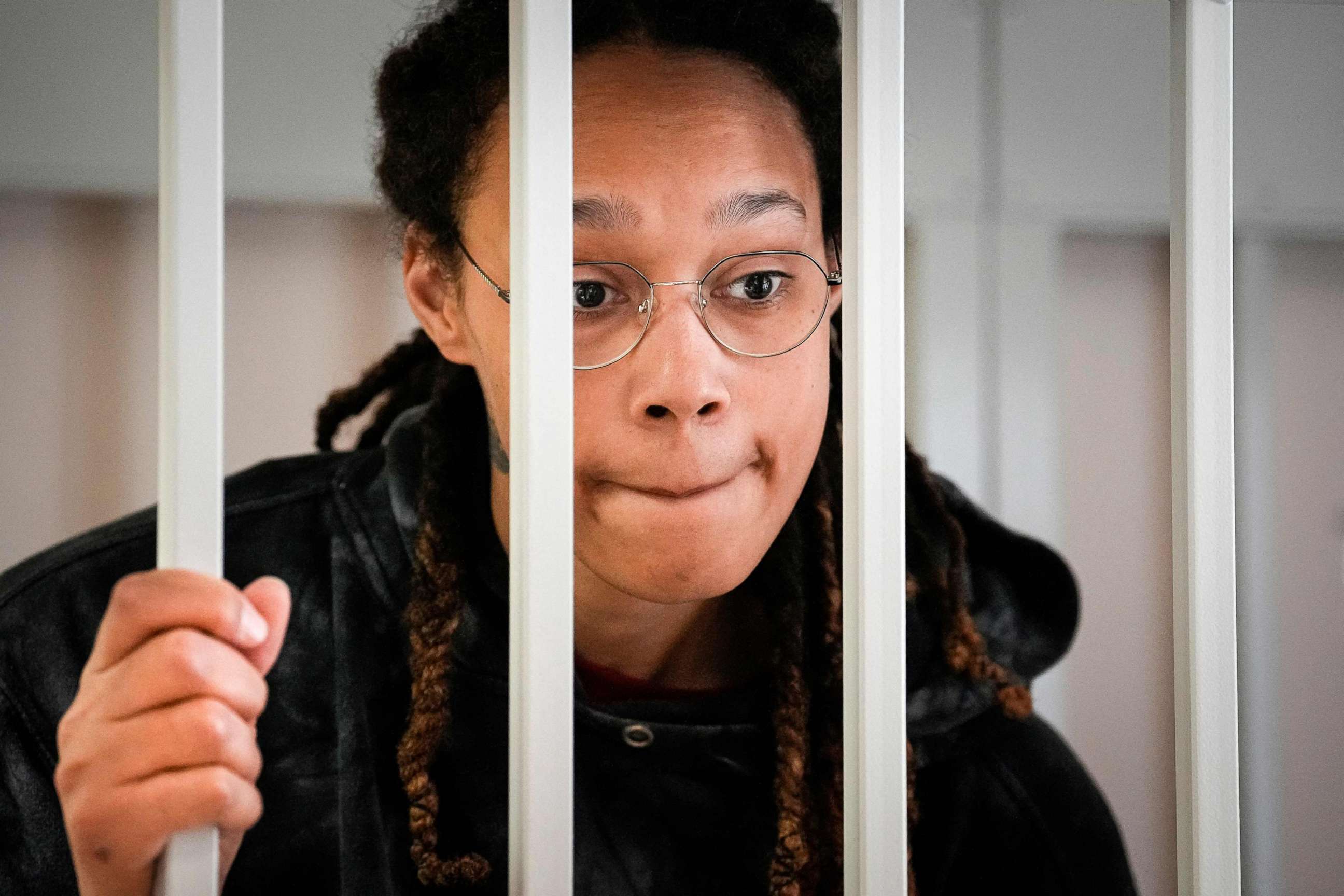 PHOTO: Brittney Griner reacts inside a defendants' cage before a hearing at the Khimki Court, outside Moscow, July 26, 2022.
