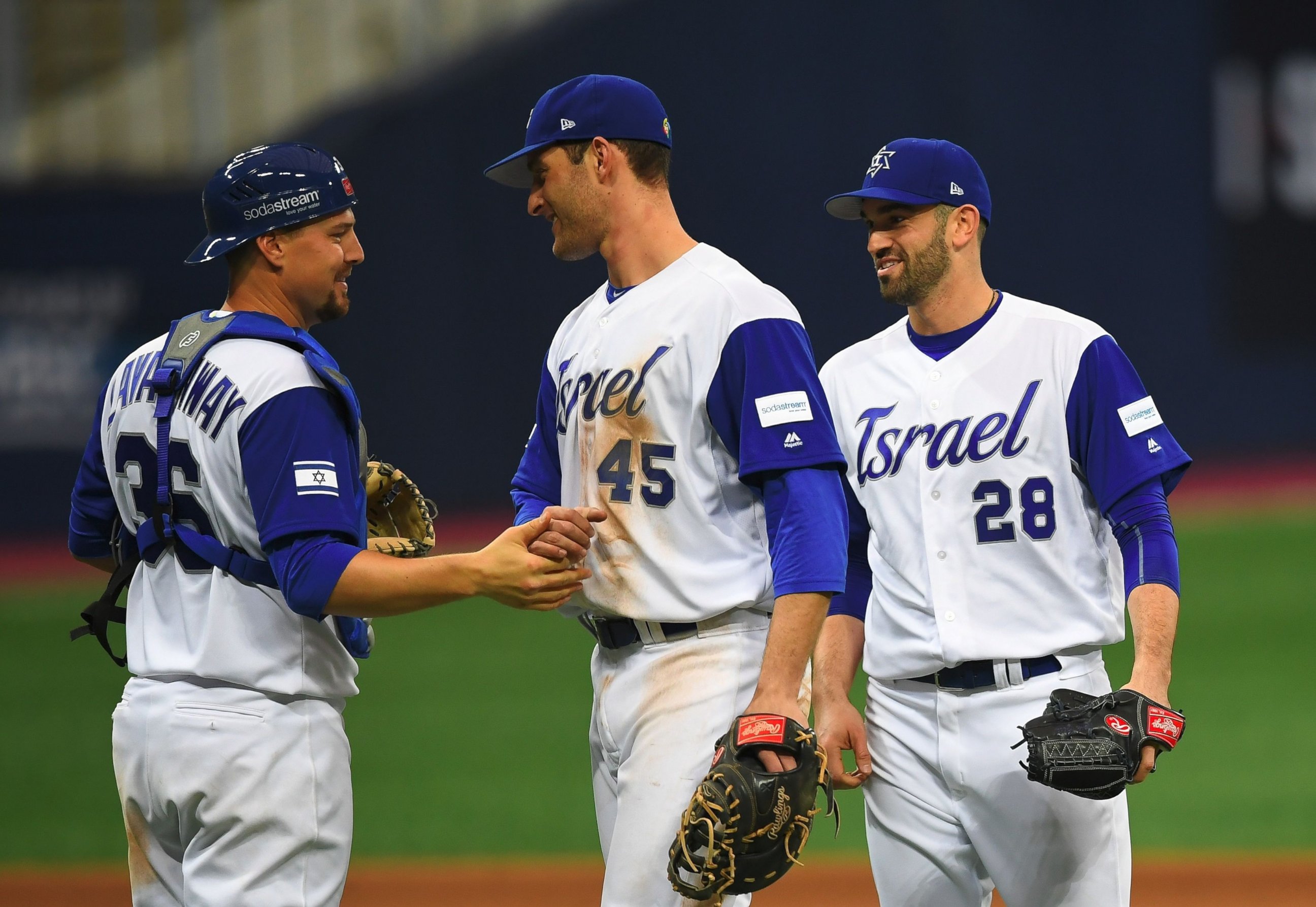 PHOTO: Catcher Ryan Lavarnway of Israel celebrates a victory over the Netherlands with infielder Nate Freiman and pitcher Josh Zeid after their first round game of the World Baseball Classic at Gocheok Sky Dome in Seoul on March 9, 2017.