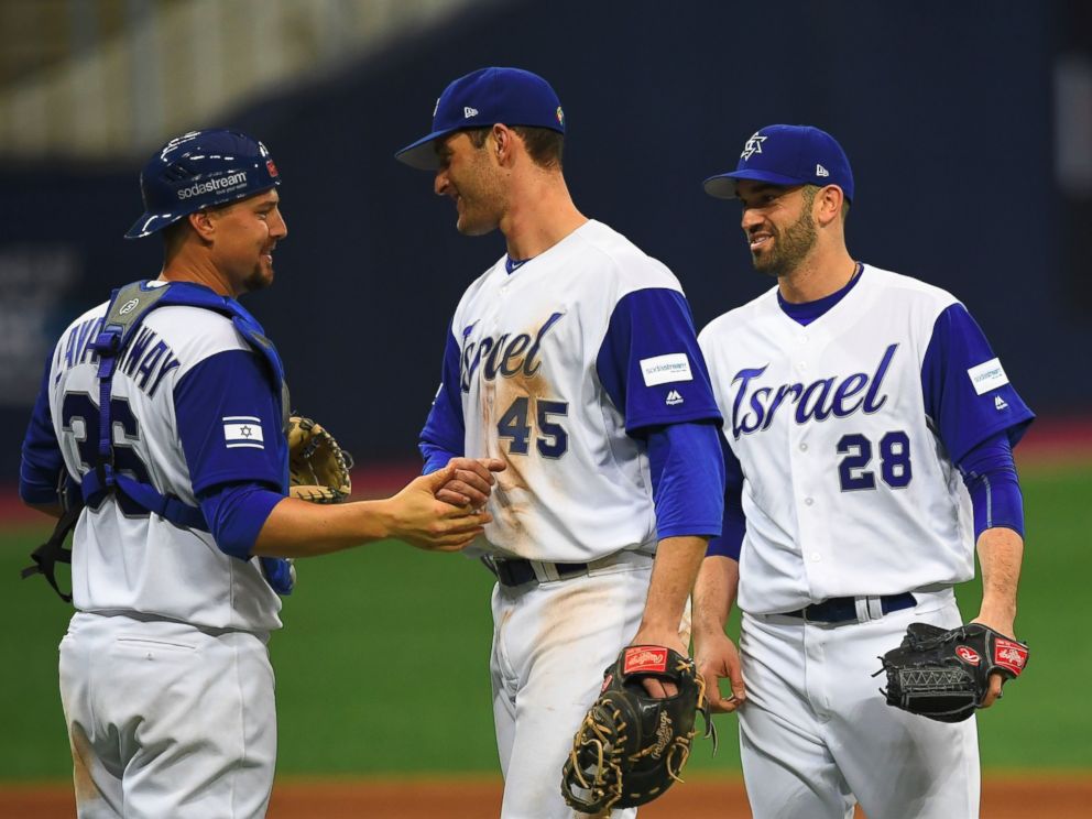 PHOTO: Catcher Ryan Lavarnway of Israel celebrates a victory over the Netherlands with infielder Nate Freiman and pitcher Josh Zeid after their first round game of the World Baseball Classic at Gocheok Sky Dome in Seoul on March 9, 2017.