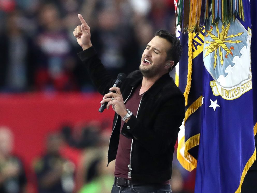 PHOTO: Luke Bryan sings the National Anthem prior to Super Bowl 51 between the New England Patriots and the Atlanta Falcons at NRG Stadium on Feb. 5, 2017 in Houston, Texas.