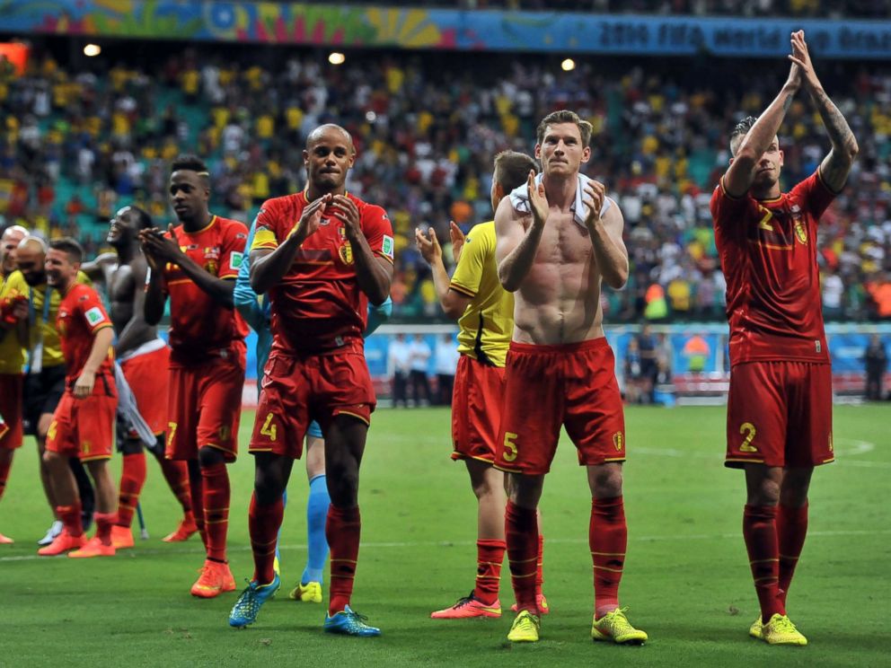 PHOTO: Belgian players celebrate their victory after the World Cup match between Belgium and the USA at the Arena Fonte Nova in Salvador, Brazil on July 1, 2014.