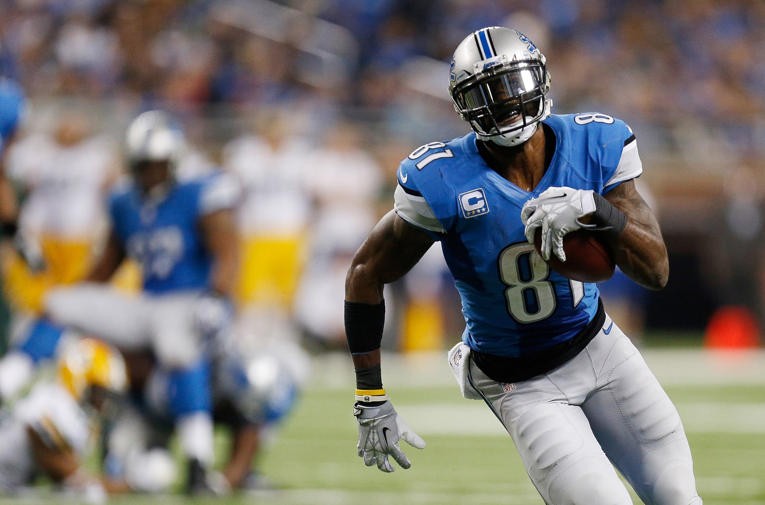 PHOTO: Calvin Johnson of the Detroit Lions runs for a third quarter touchdown at Ford Field on Nov. 28, 2013 in Detroit, Michigan.