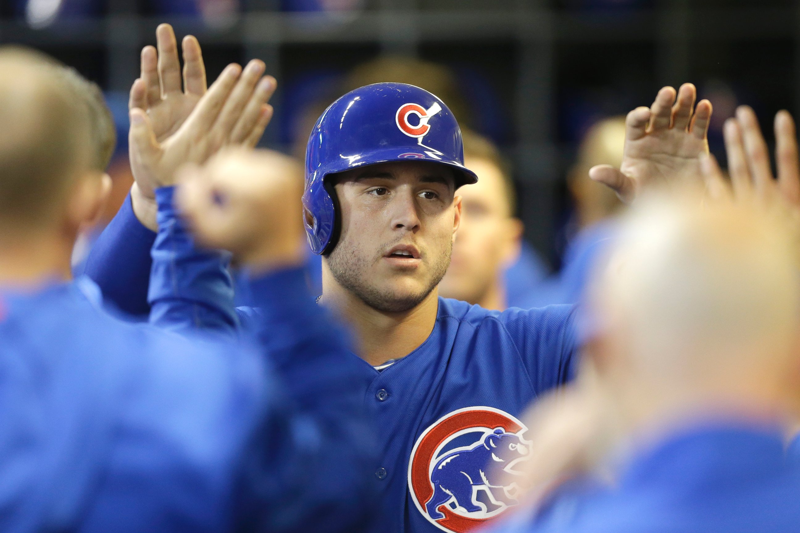 PHOTO: Anthony Rizzo #44 of the Chicago Cubs celebrates in the dugout after reaching on a double hit by Starlin Castro in the seventh inning against the Milwaukee Brewers at Miller Park on October 02, 2015 in Milwaukee, Wisconsin.