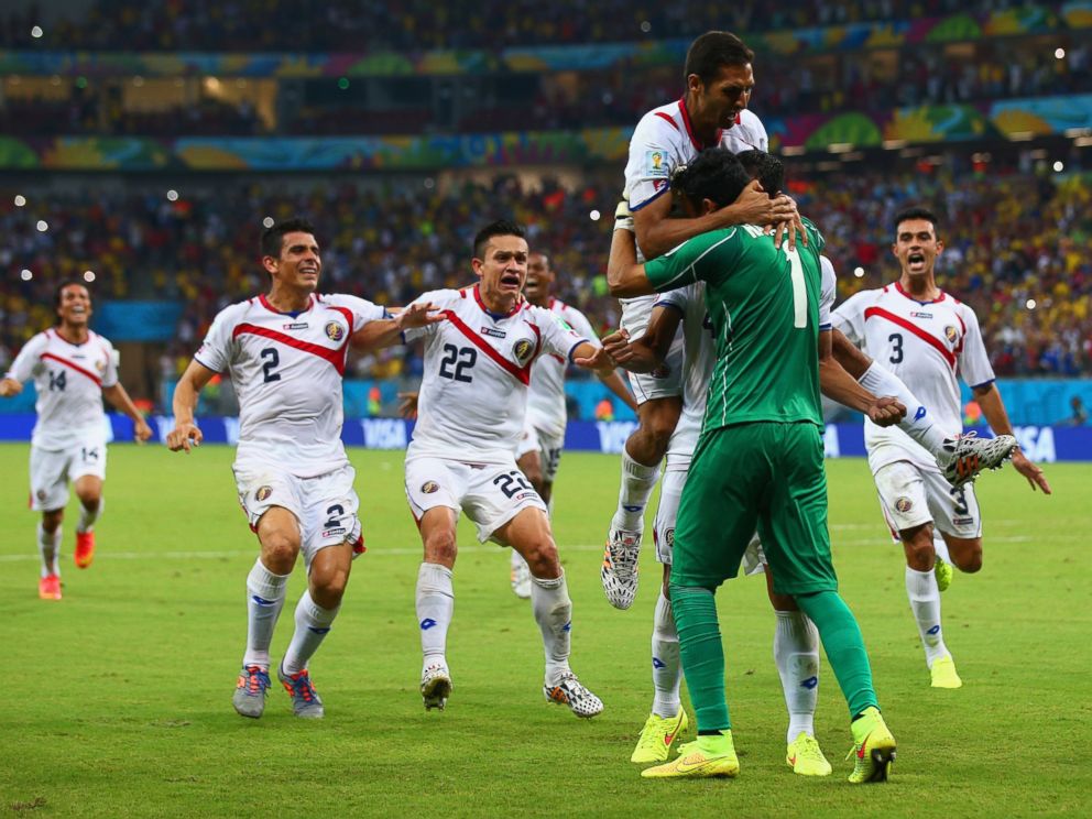 PHOTO: Keylor Navas of Costa Rica is swarmed by teammates in celebration after defeating Greece during the 2014 FIFA World Cup Brazil match at Arena Pernambuco on June 29, 2014 in Recife, Brazil.