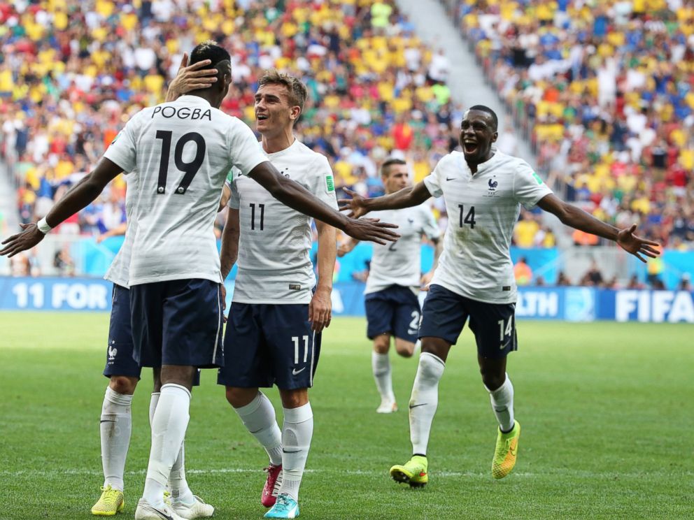 PHOTO: Paul Pogba of France celebrates scoring his teams first goal with his teammates Antoine Griezmann and Blaise Matuidi during the 2014 FIFA World Cup Brazil match between France and Nigeria at Estadio Nacional on June 30, 2014 in Brasilia, Brazil.