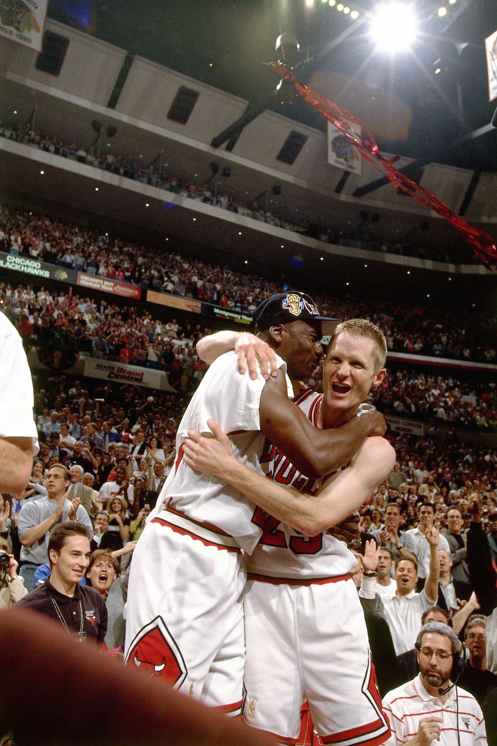 PHOTO: Steve Kerr and Michael Jordan of the Chicago Bulls celebrate after defeating the Utah Jazz to win the NBA Championship at the United Center in Chicago, 1997.