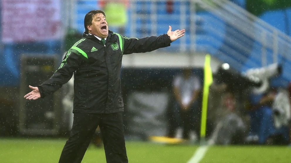 Mexico's coach Miguel Herrera gestures during the soccer match between Mexico and Cameroon in Natal during the 2014 FIFA World Cup on June 13, 2014.
