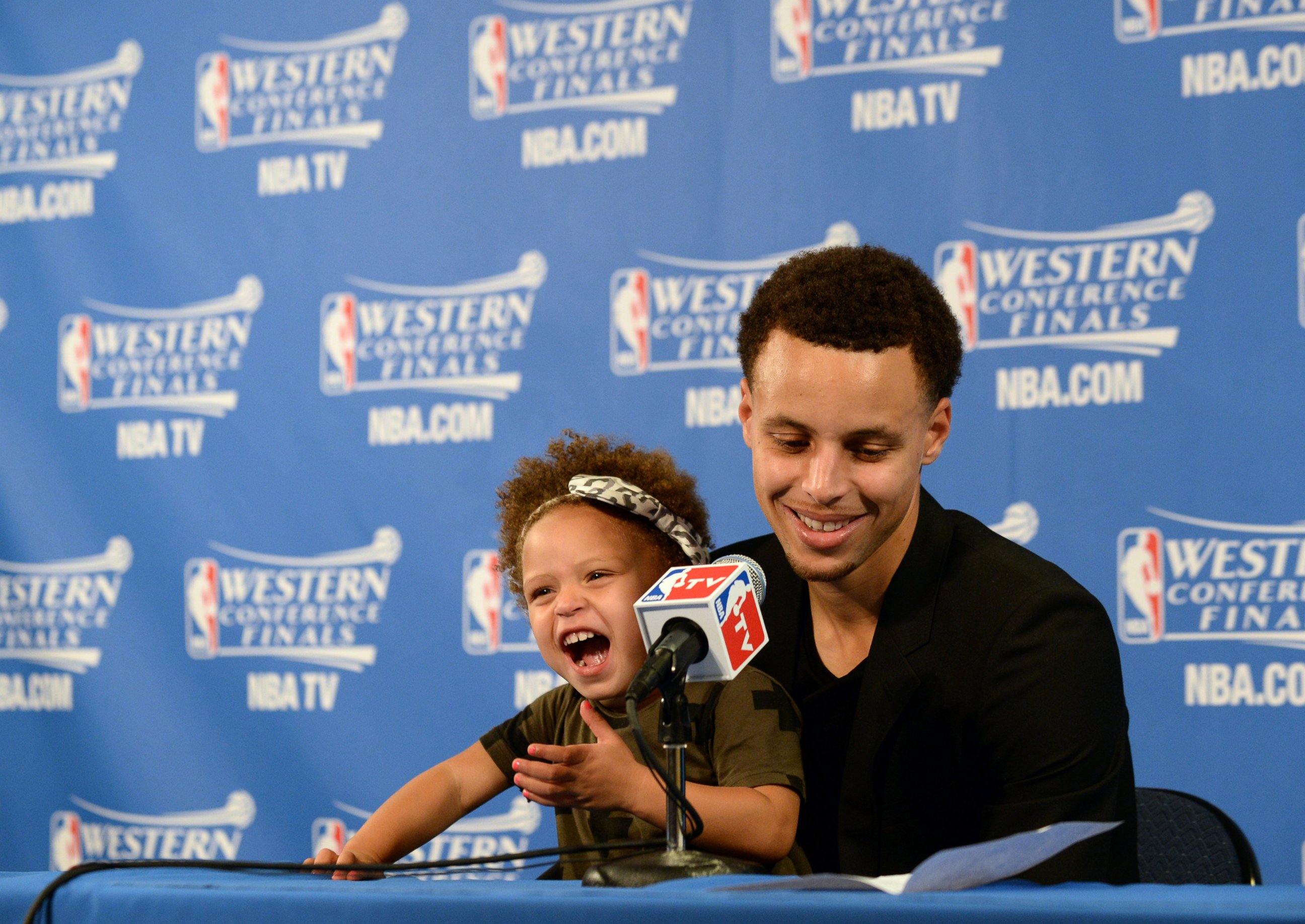 PHOTO: Stephen Curry of the Golden State Warriors and his daughter Riley speak at a press conference after Game One of the Western Conference Finals during the NBA Playoffs at Oracle Arena in Oakland, Calif., May 19, 2015.