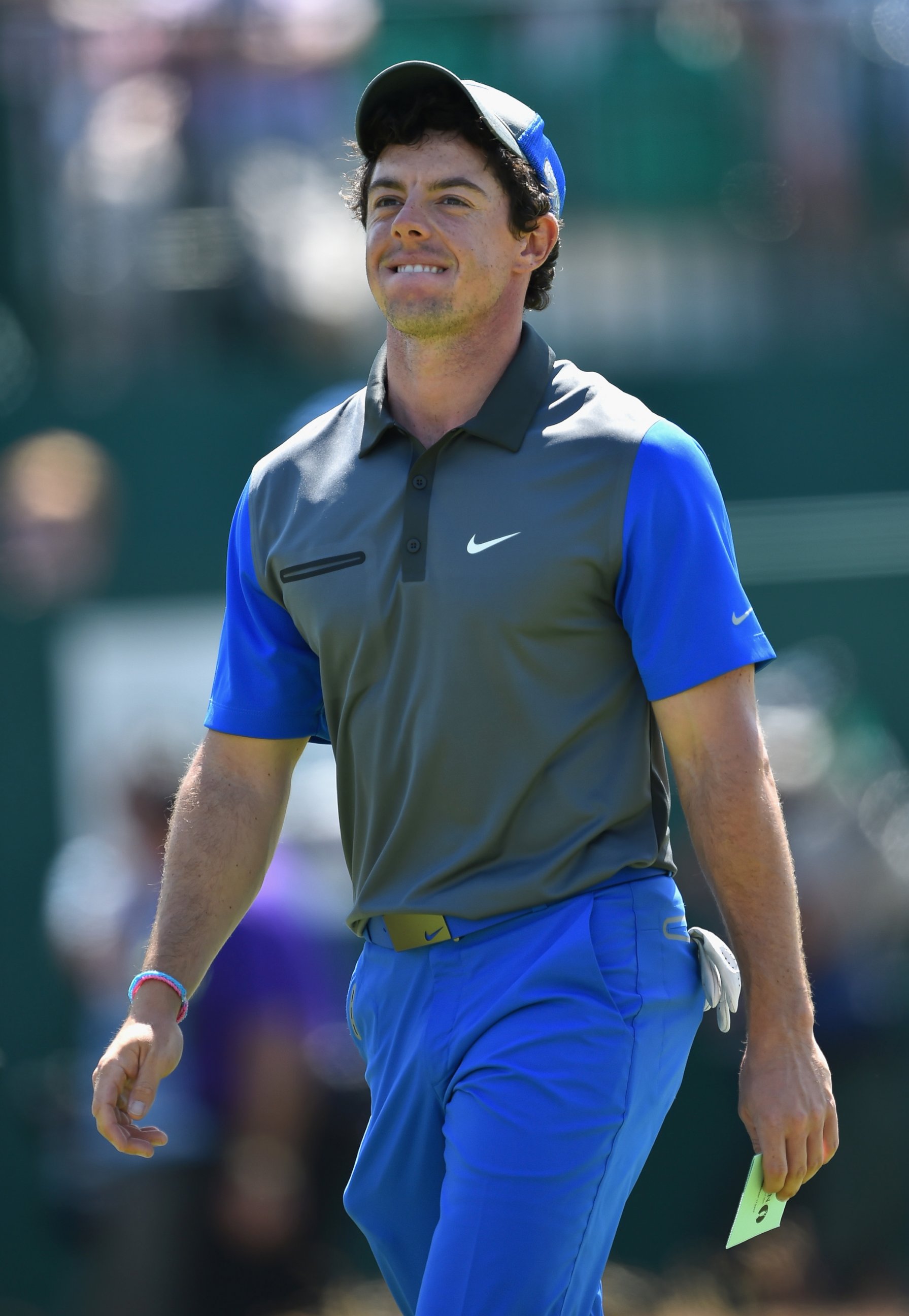 PHOTO: Rory McIlroy of Northern Ireland walks off the 18th green during the first round of The 143rd Open Championship at Royal Liverpool on July 17, 2014 in Hoylake, England.