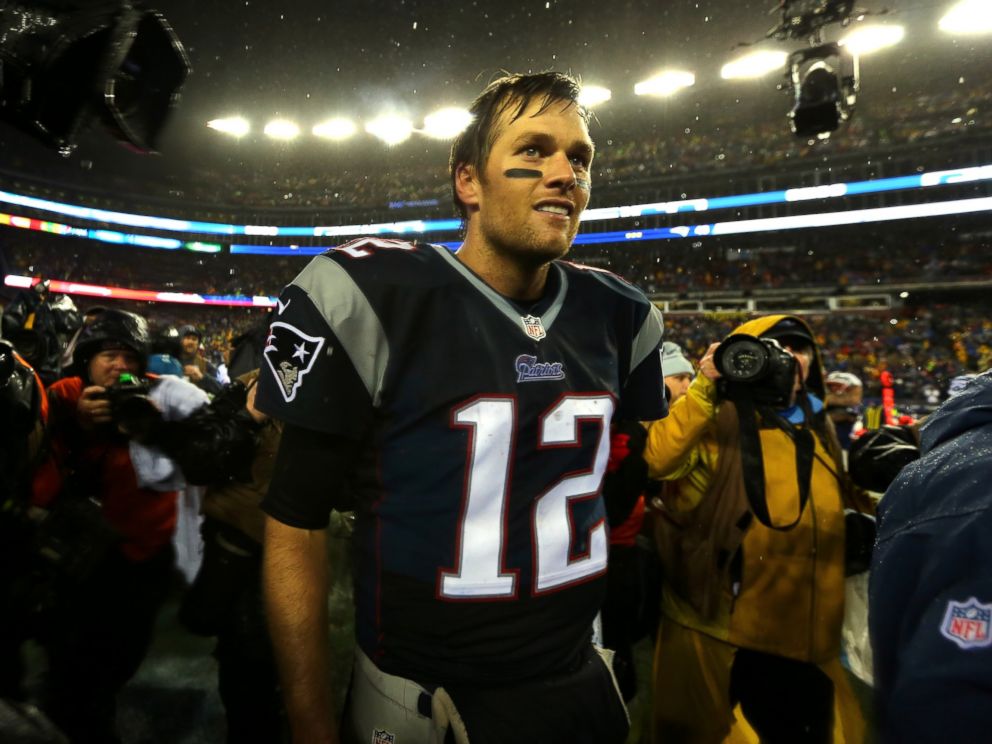 PHOTO: Tom Brady of the New England Patriots walks through the media after defeating the Indianapolis Colts in the 2015 AFC Championship Game at Gillette Stadium on Jan. 18, 2015 in Foxboro, Mass.
