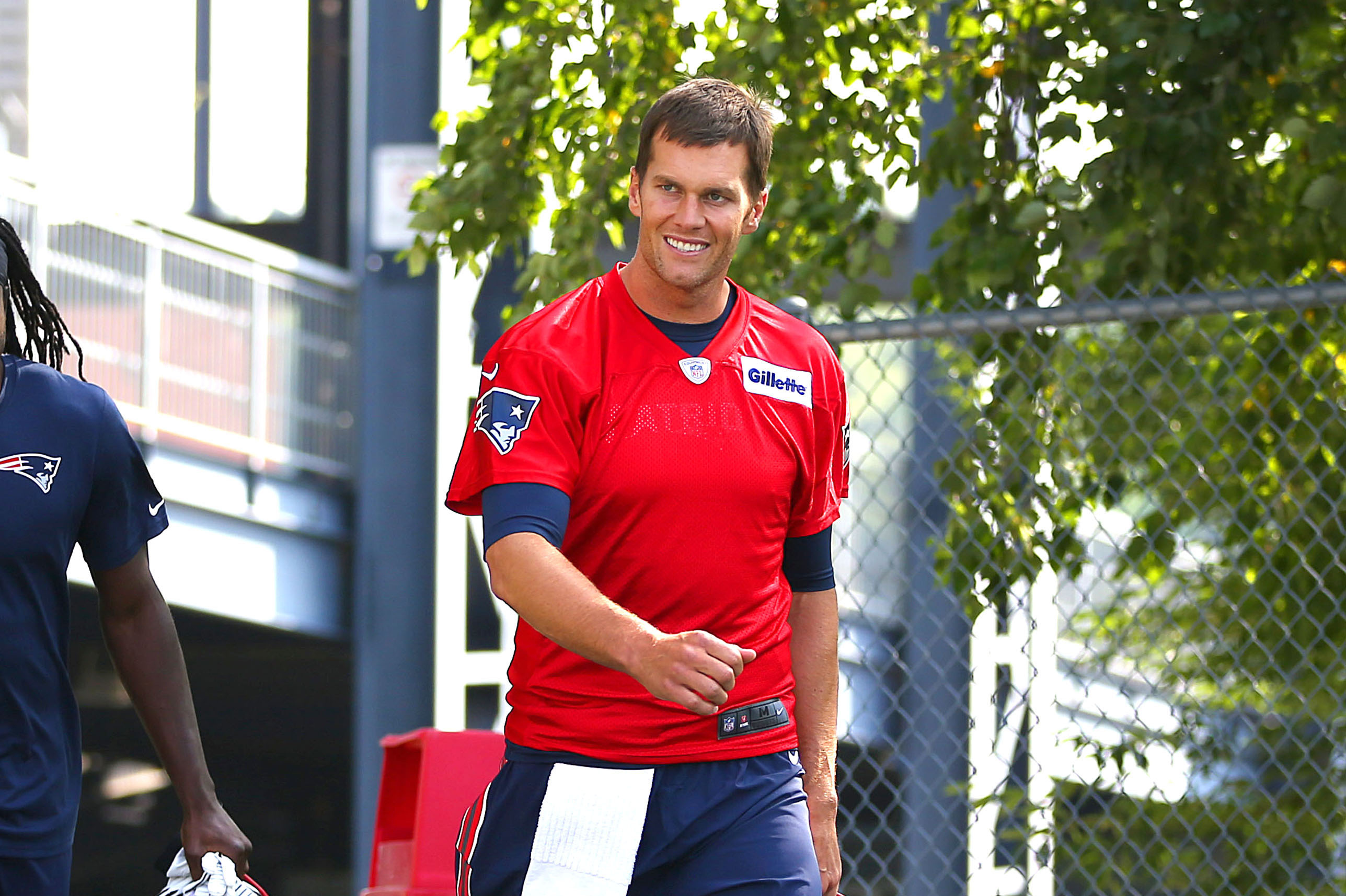 PHOTO:Tom Brady walks on to the field of The New England Patriots first day of training camp at the practice field next to Gillette Stadium, July 30, 2015, in Foxborough, Mass. 
