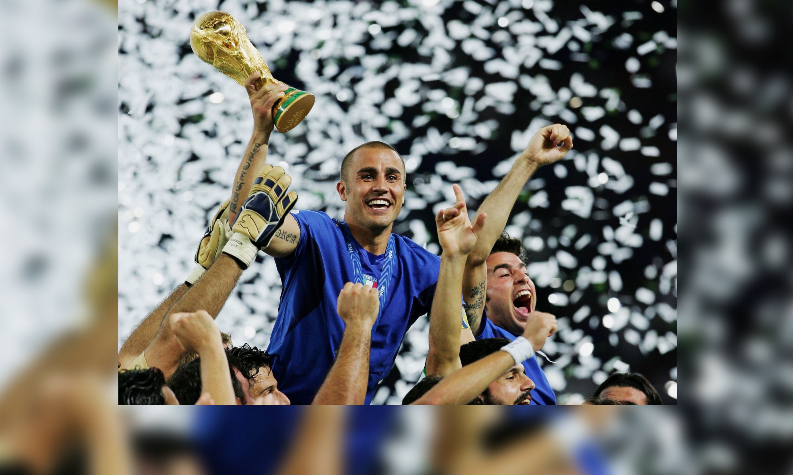 PHOTO: Fabio Cannavaro of Italy lifts the World Cup trophy aloft following victory in a penalty shootout at the end of World Cup Final match between Italy and France at the Olympic Stadium on July 9, 2006 in Berlin, Germany.
