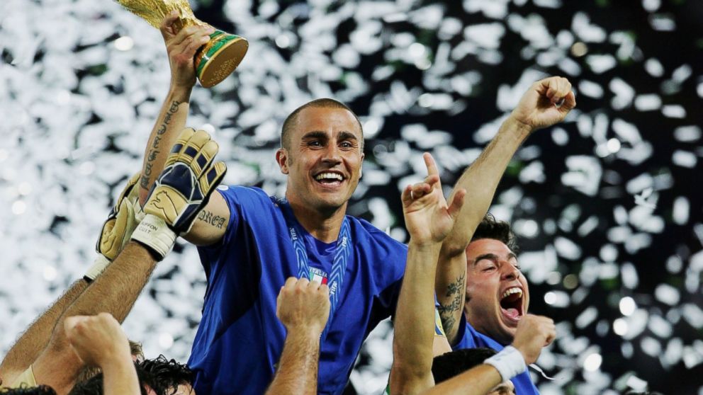 PHOTO: Fabio Cannavaro of Italy lifts the World Cup trophy aloft following victory in a penalty shootout at the end of World Cup Final match between Italy and France at the Olympic Stadium on July 9, 2006 in Berlin, Germany.